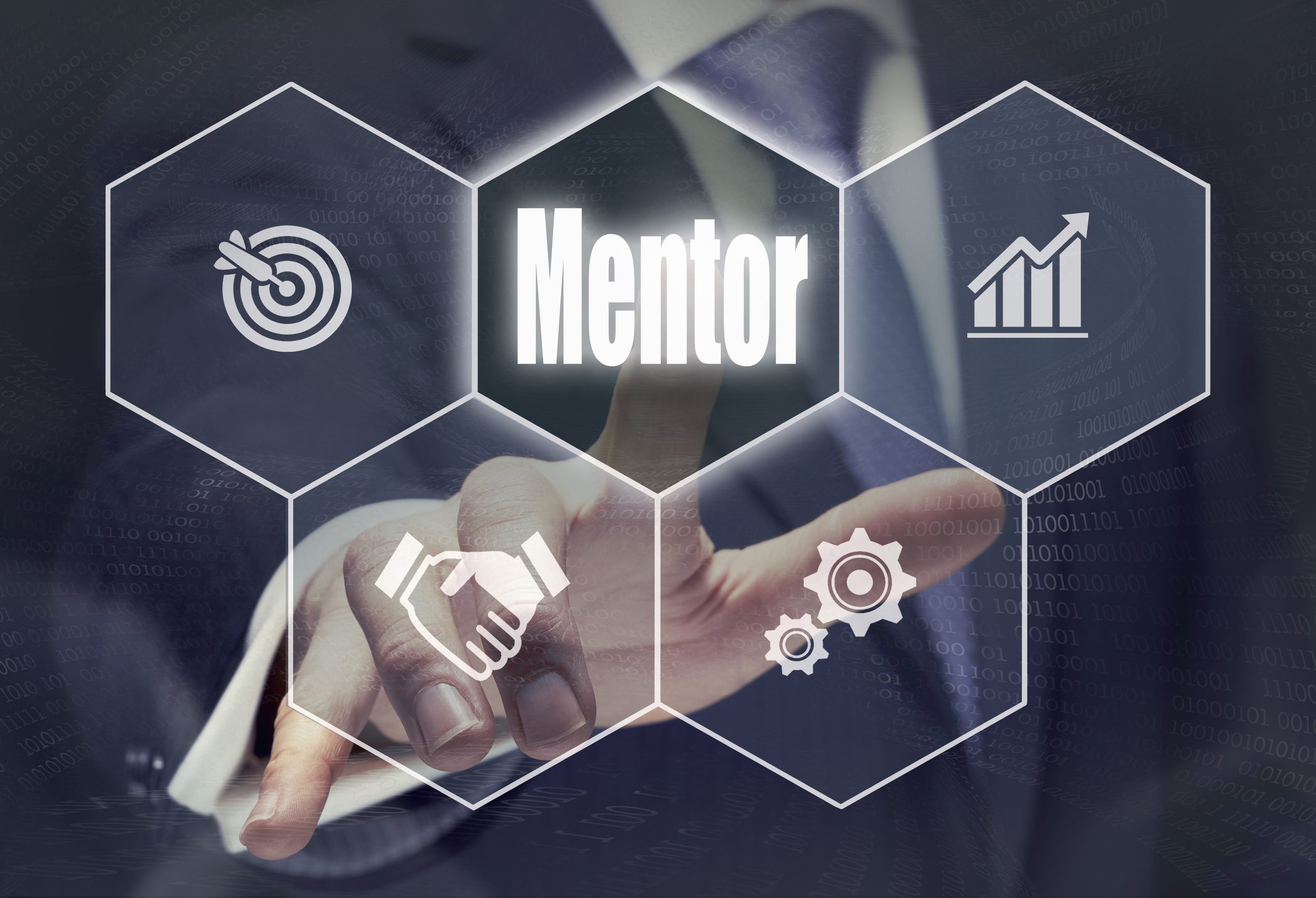 Businessman pressing a Mentor concept button.