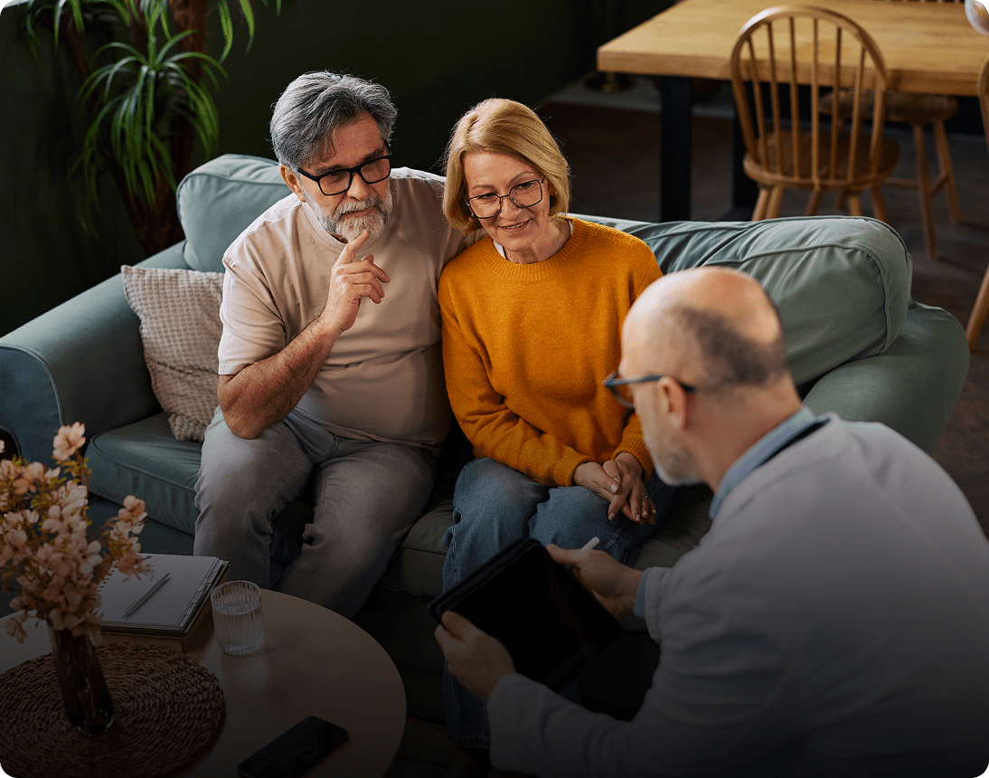 Seniors receiving medical advice at home.