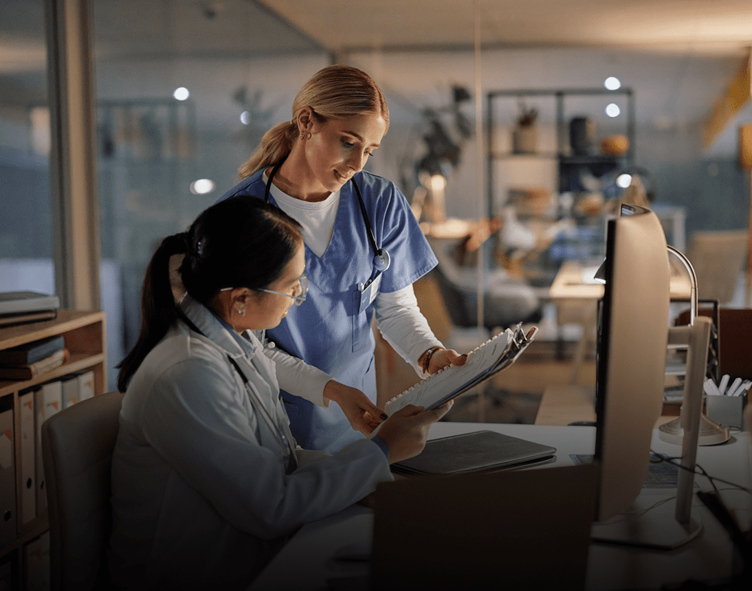 Doctors reviewing patient chart in office